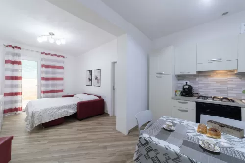 terra d'occidente - cucina bilocale divano letto